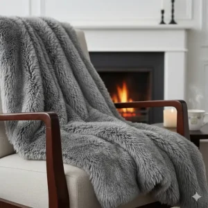 A high-quality grey faux fur throw blanket showing a soft texture, perfect for winter nights.