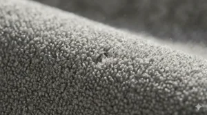 Macro shot of high-quality synthetic fleece fibres, demonstrating the quick-dry properties of low maintenance blankets.