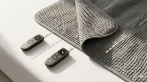 Illustration showing an electric blanket with two separate remote controls for independent temperature adjustment.