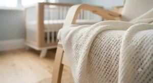 A close-up showing the lightweight, open-weave texture of the breathable baby blanket.