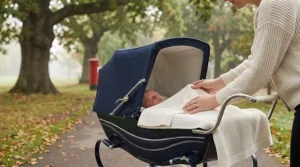 Cotton cellular blanket neatly tucked into a pram for a comfortable outdoor stroll.