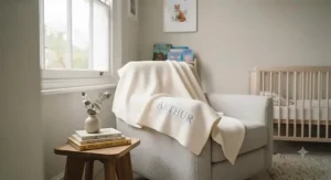 Scandi-inspired British nursery room interior featuring a custom name blanket styled on a rocking chair.