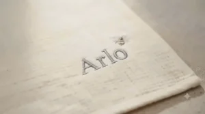 Close-up of the delicate 'Arlo' embroidery and bee detail on a soft nursery blanket.