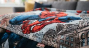 Close-up of a soft fleece blanket featuring a detailed and vibrant Spider-Man graphic print.