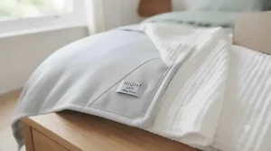 An all-season double-sided cooling blanket showing both the warm-weather cooling side and cozy winter side.