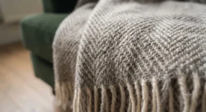 Macro view showing the soft, breathable woven texture of a high-grade thermal blanket fibre.