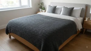 Extra-large heavy winter blanket fully covering a UK king-size bed to lock in warmth from top to toe.
