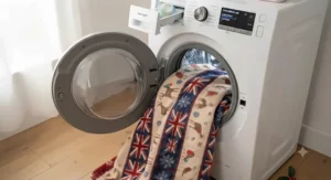 Durable and machine-washable Christmas blanket for kids folded on a chair.