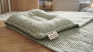 Dedicated name label tag on a nursery nap blanket to prevent mix-ups at preschool or nursery school.