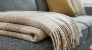 Close-up shot showing the tactile, breathable weave and soft texture of a versatile multi-season throw suitable for all-year-round home use.